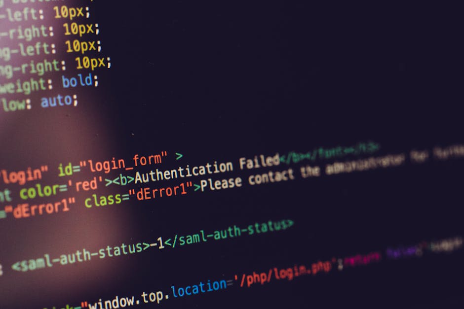 A close-up view of a computer screen displaying HTML and CSS code with colorful syntax highlighting. The lines include labels such as 'login', 'Authenti cation Failed', and 'Please contact the adminis